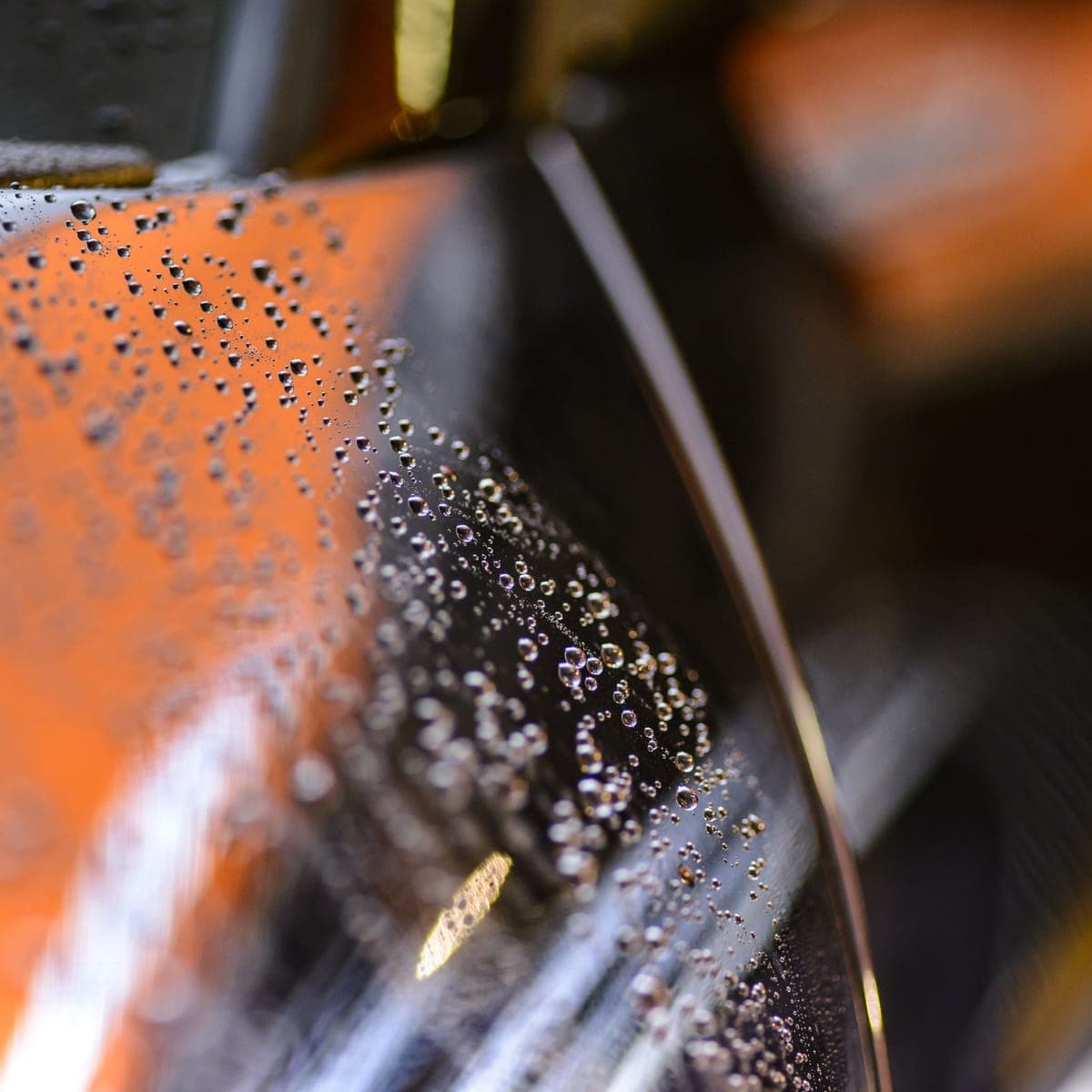 Water beading tight across a freshly coated panel.